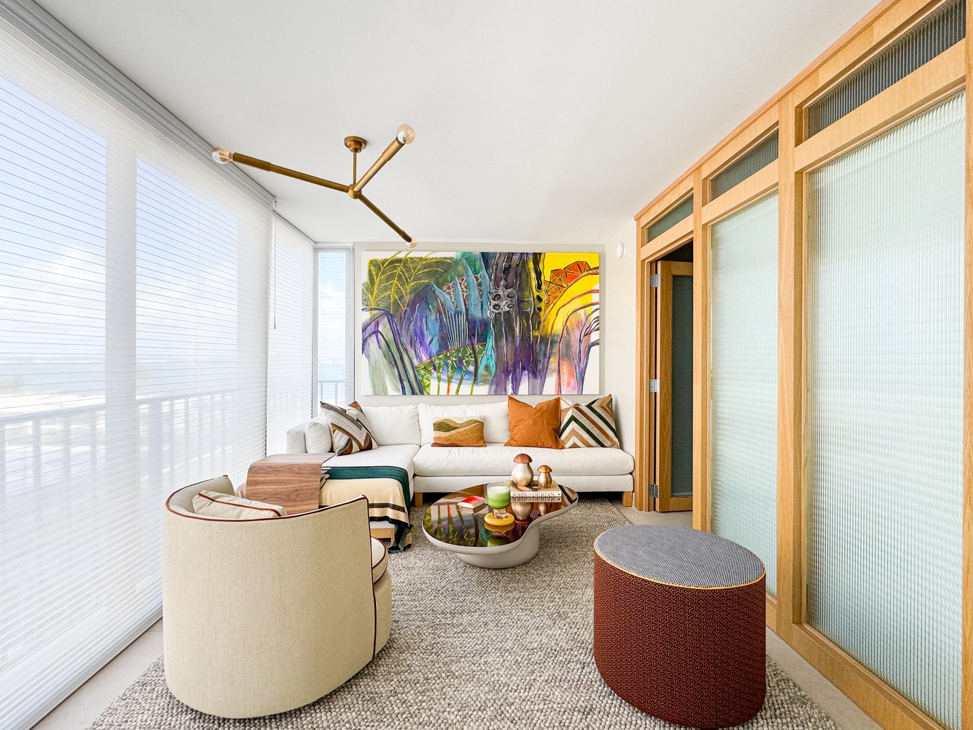 Living room and custom partitions at Brickell Apartment